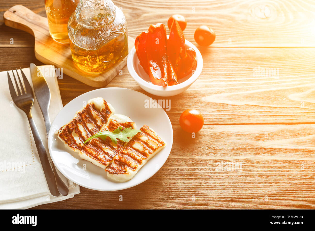Halloumi grilled cheese with grilled bell peppers and tomatoes, copy space for text Stock Photo