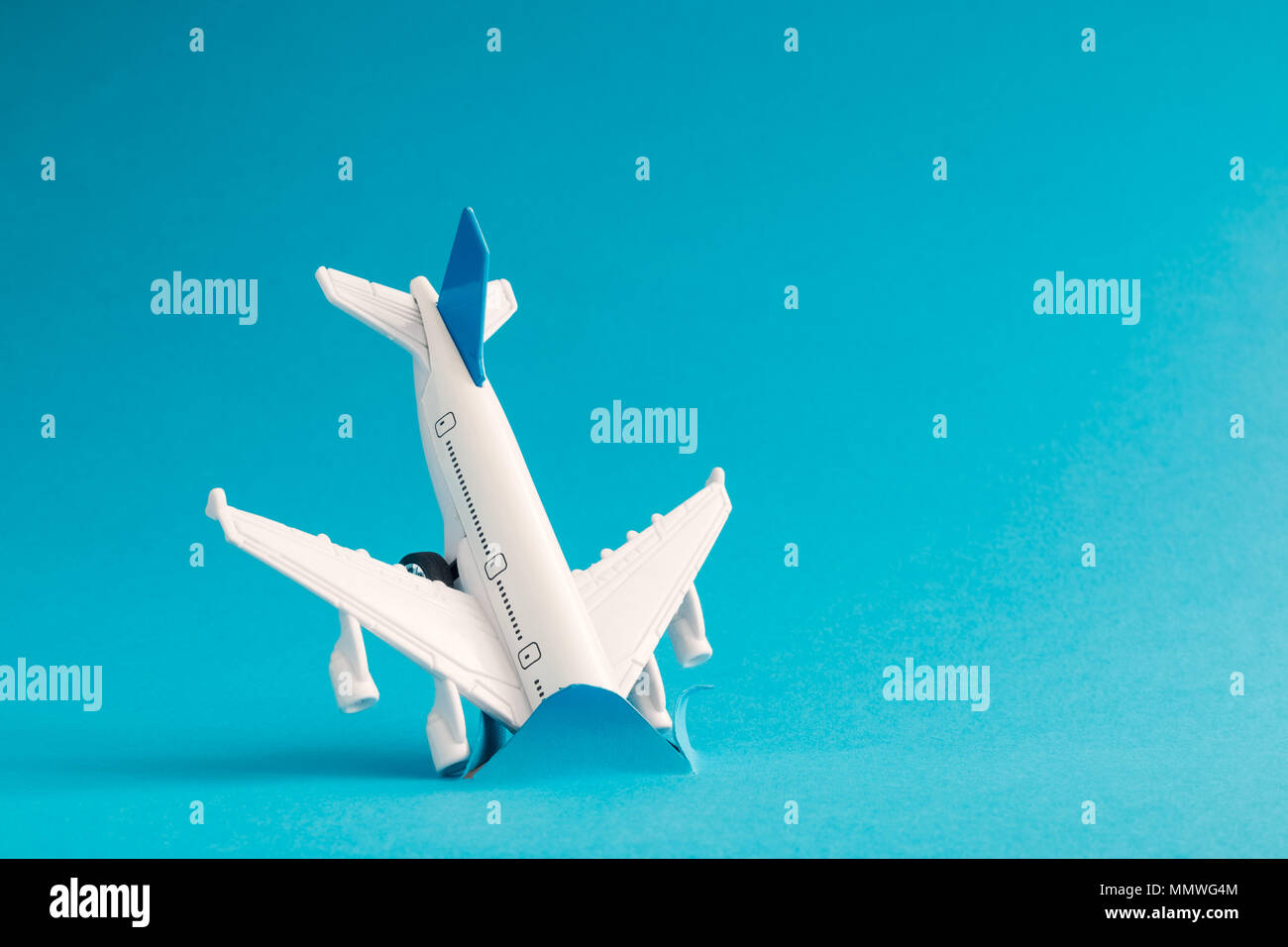 Airplane accident in ocean minimal creative concept. Stock Photo