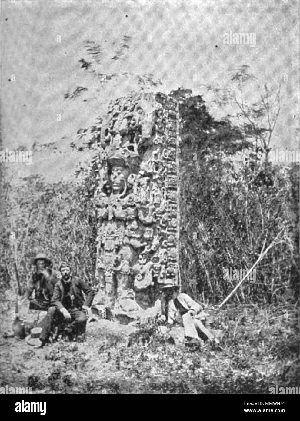 . English: Explorers next to a Maya stelae in the 1800s.  . 19 January 2013, 20:14:35. JVC3ETA Not Credited Copan ruinas 1800s Stock Photo