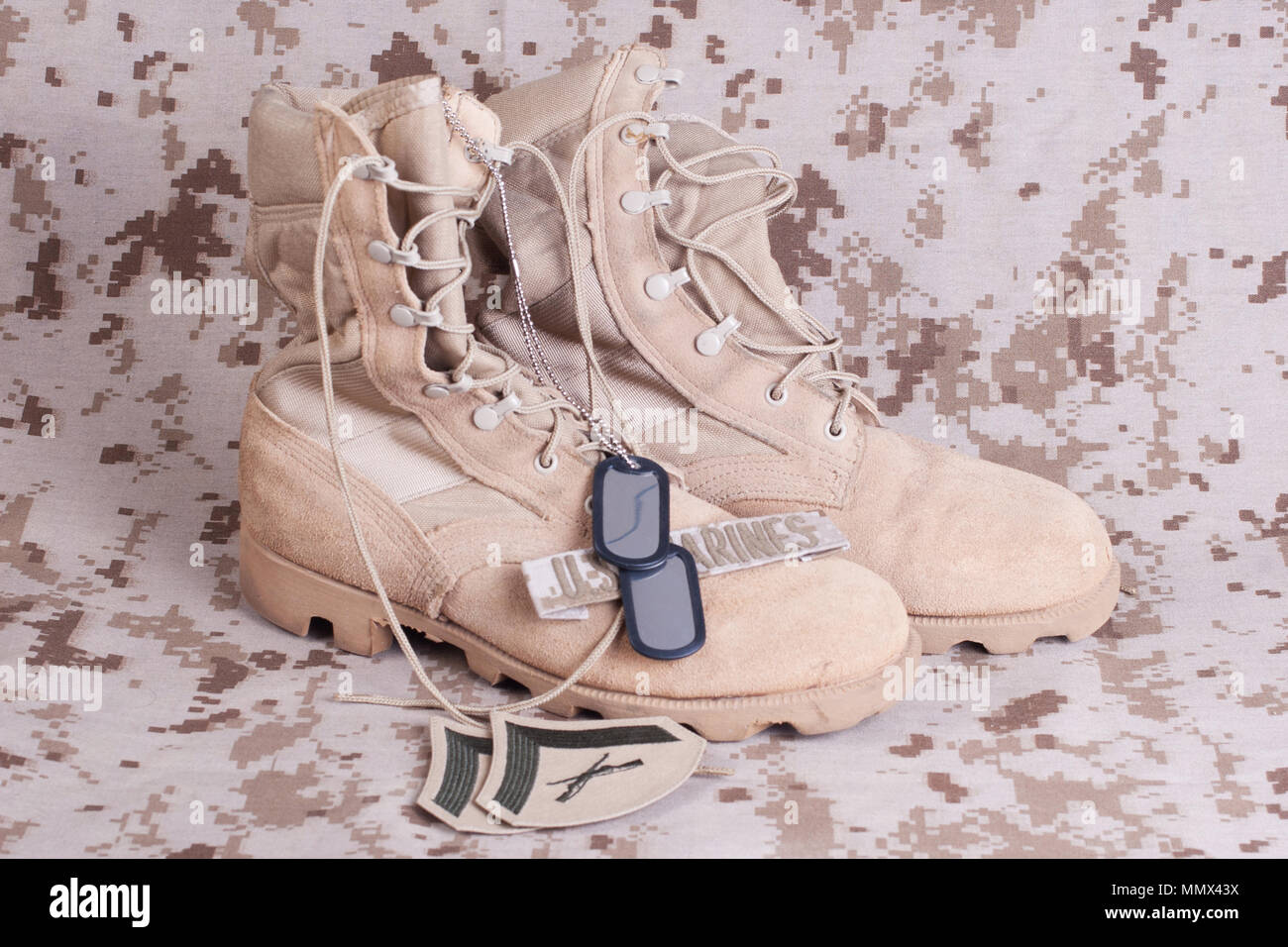 US Marines concept with firearms, boots and camouflaged uniform Stock