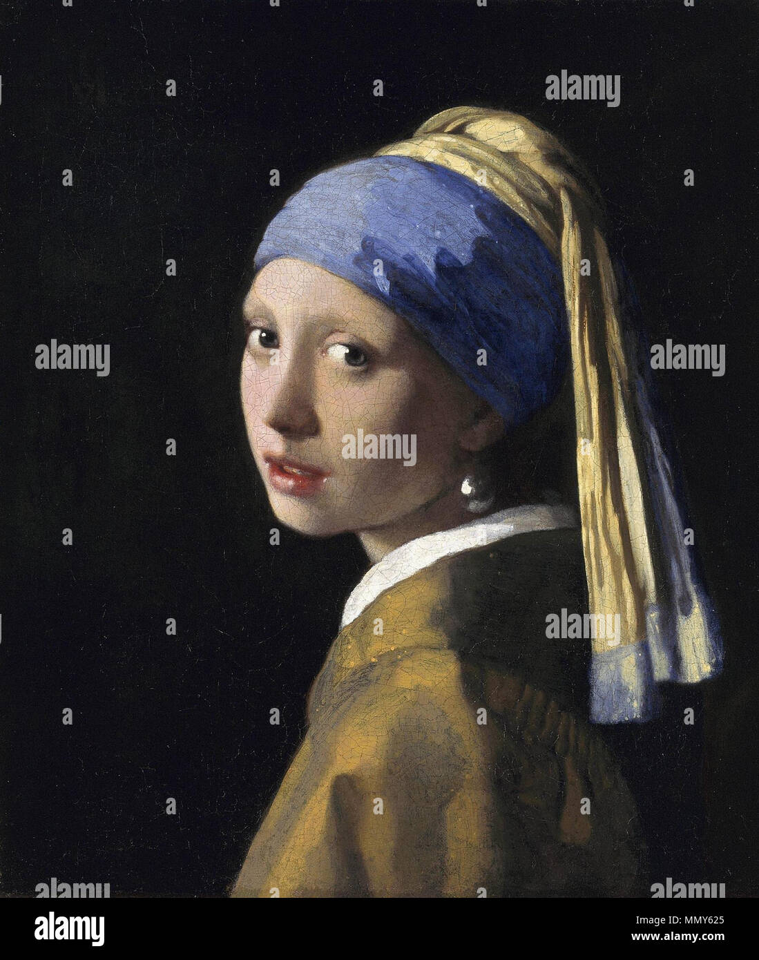 . Portrait of a girl, at bust-length, facing left, looking at the viewer. She is wearing a yellow and blue turban, a light brown coat and an earring with a single pearl. The painting is an example of a tronie, a common genre of the time depicting stock characters rather than any given individual.  The Girl with a Pearl Earring. Circa 1665. Girl with a Pearl Earring Stock Photo