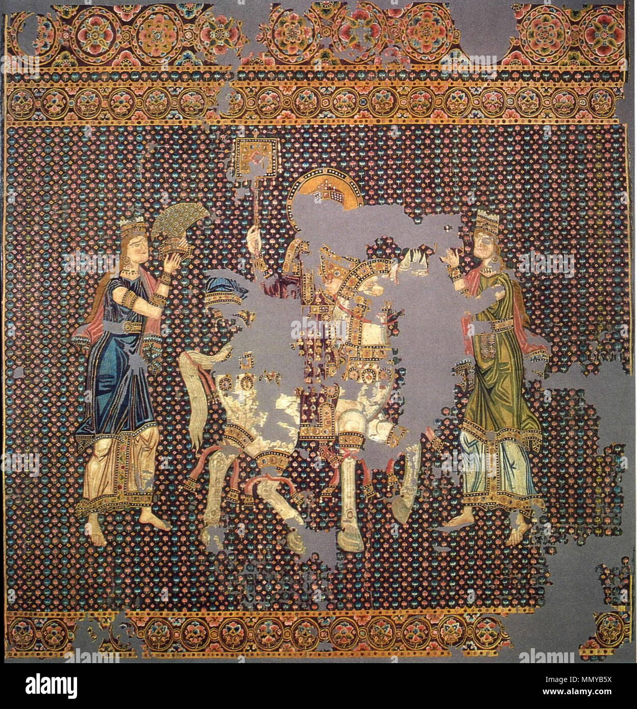 . English: The so-called 'Bamberger Gunthertuch', a Byzantine silk tapestry depicting a Byzantine emperor on his triumphant return from a campaign. He is crowned, bears the labarum and rides a white horse. Originally identified as Basil II (by A. Grabar), it is now accepted that he represents John I Tzimiskes on his return from the campaign against the Rus' in Bulgaria. He is flanked by two female tychae, who personify Constantinople's two demoi, the Blues and the Greens. The one on the right offers [possibly] a crown, and the one on the left a triumphal toupha headdress. The silk was acquired Stock Photo