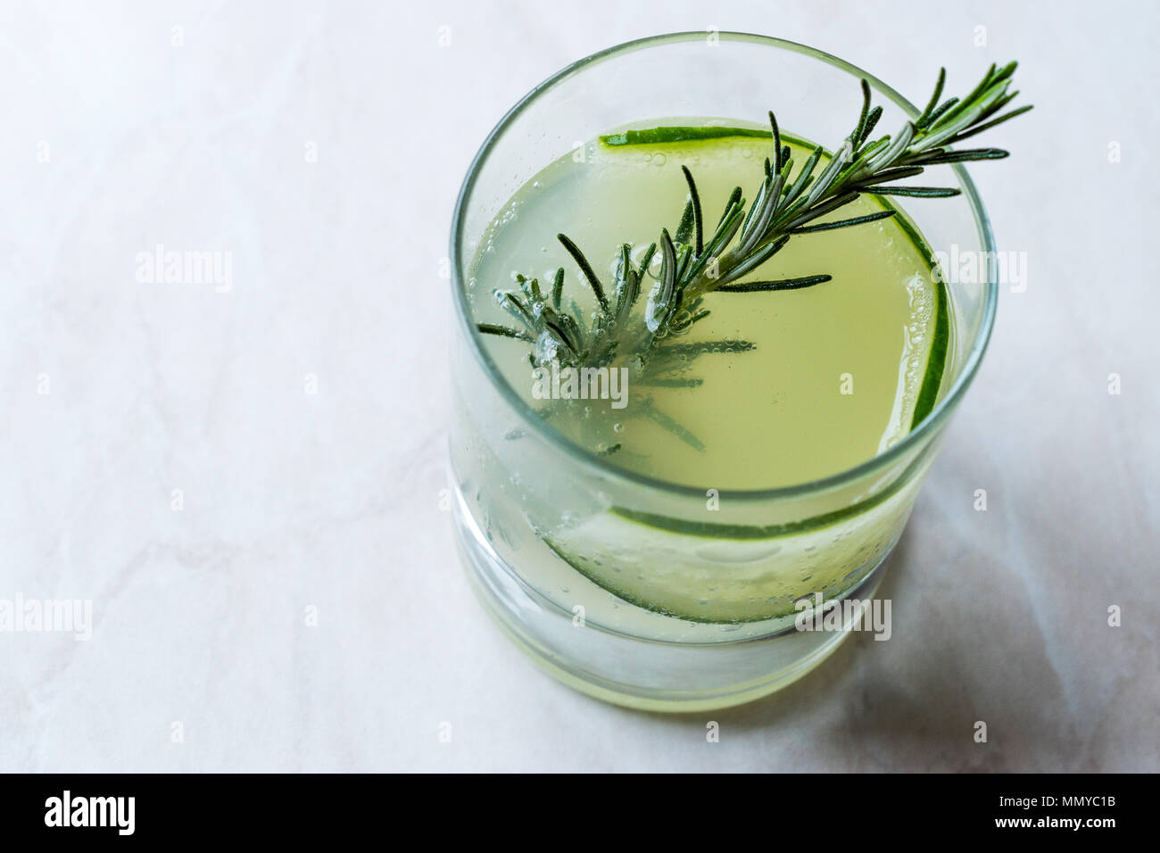 Rosemary Gin Gimlet Cocktail with Cucumber Slice. Beverage Concept