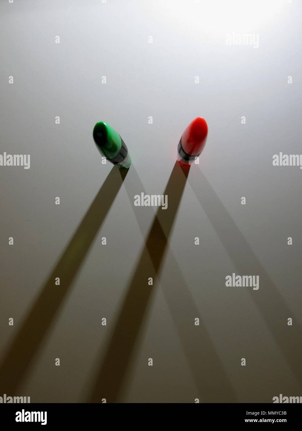 Highlighters casting shadows on white background. Stock Photo