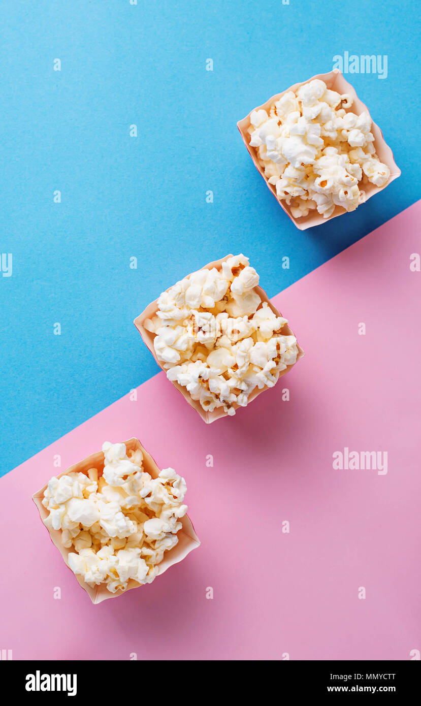 Popcorn on blue and pink background Stock Photo Alamy
