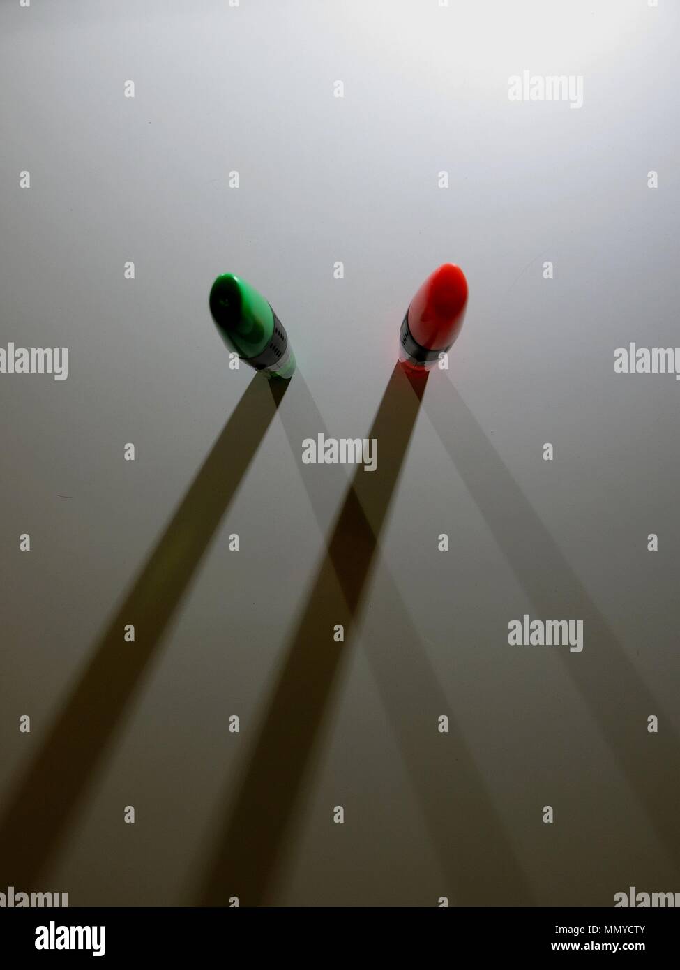Highlighters casting shadows on white background. Stock Photo