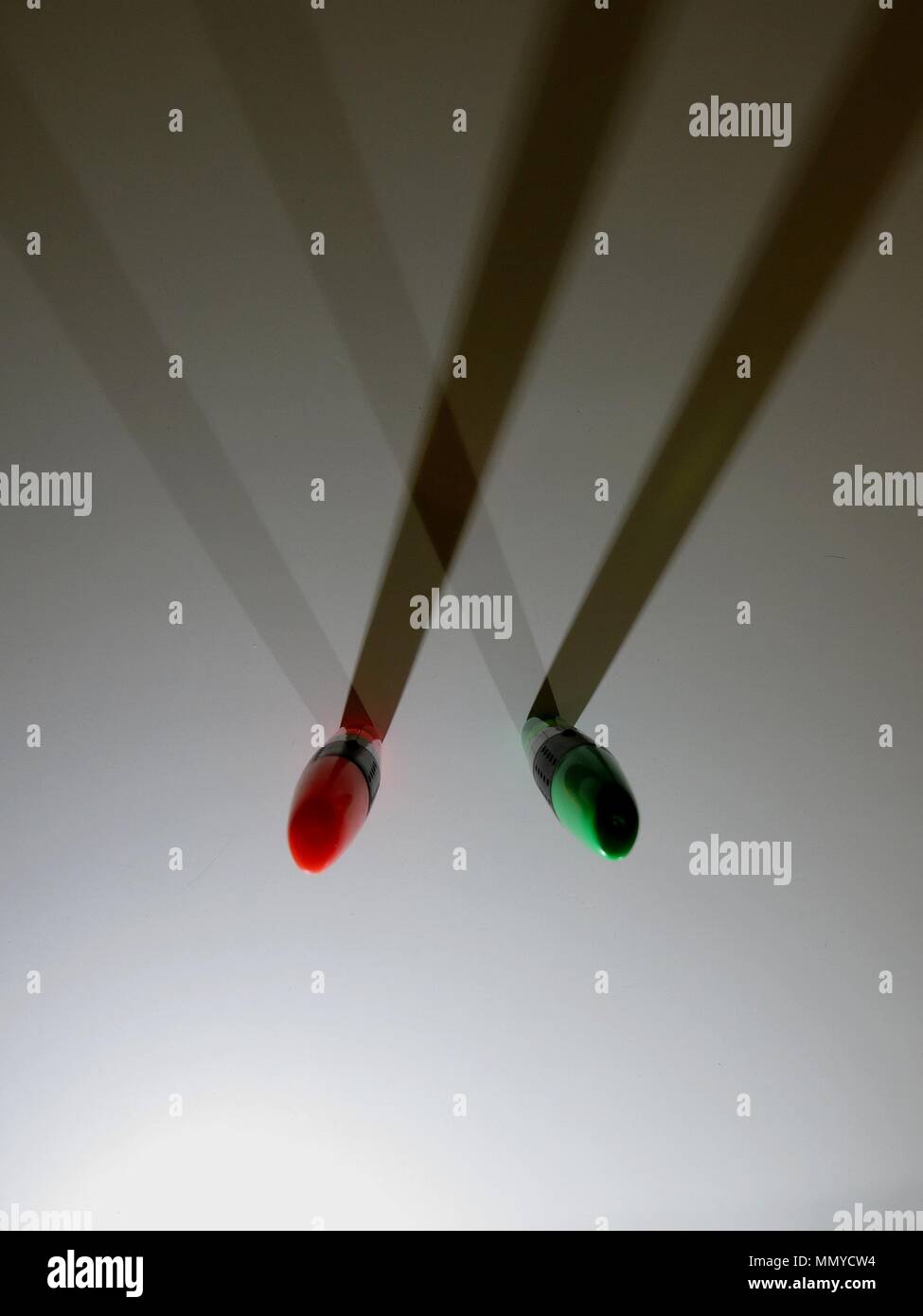 Highlighters casting shadows on white background. Stock Photo