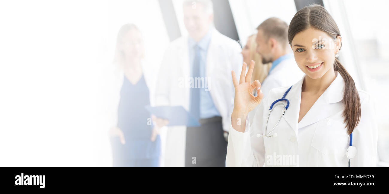 Young female doctor in front of medical team in hospital Stock Photo ...
