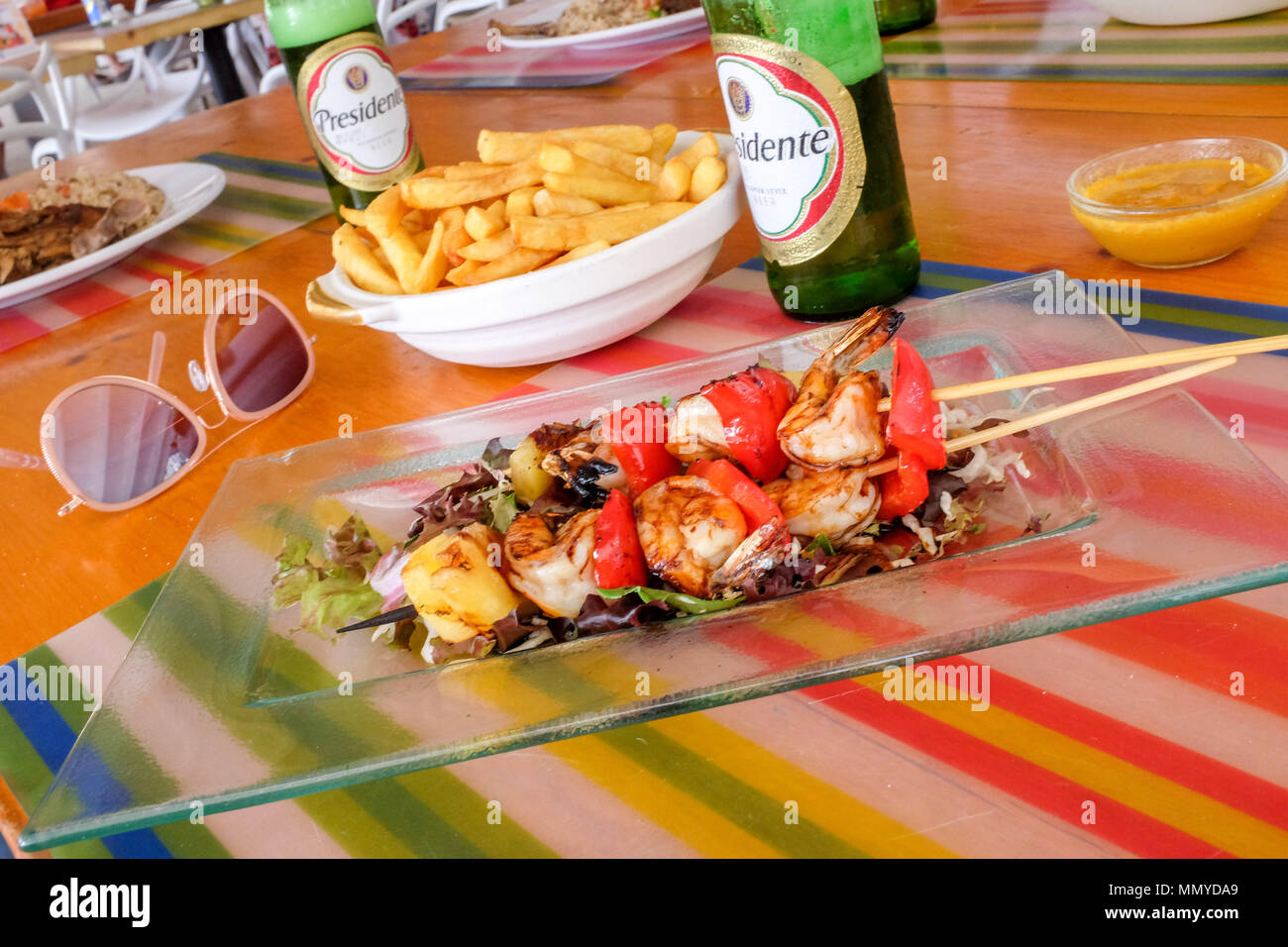 Antigua Lesser Antilles islands in the Caribbean West Indies - Typical bar cafe lunch of spicy prawns shrimp kebab with french fries or chips Stock Photo