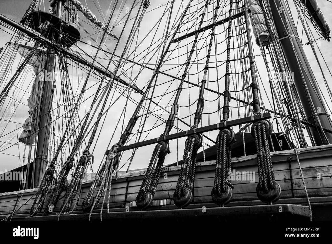 Black and white photo of the masts and rigging of the tall ship U.S. Brig Niagara. Stock Photo