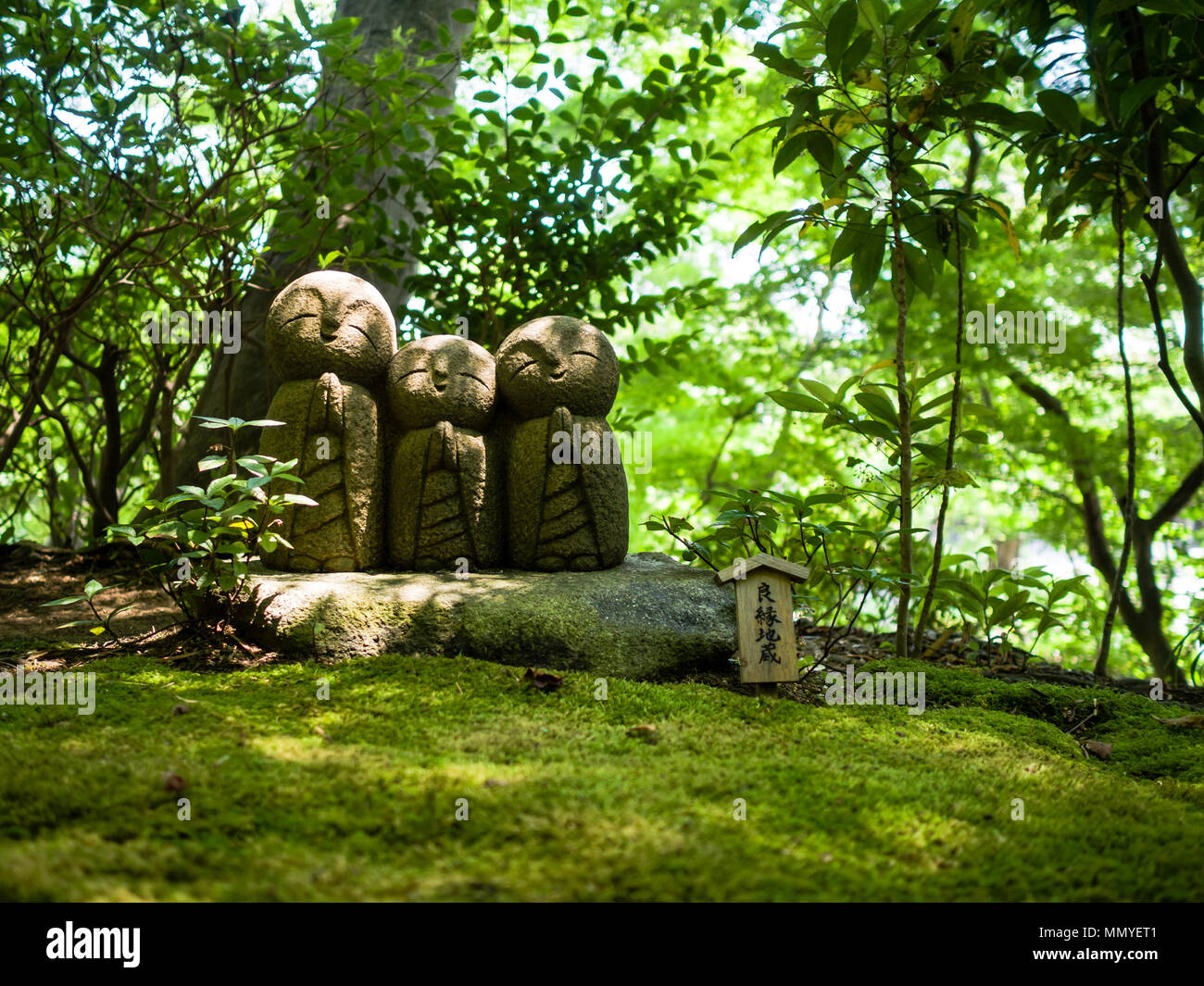 Praying stone statues in Japan Stock Photo Alamy
