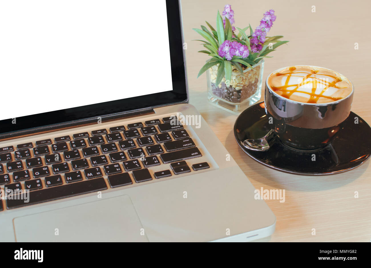 coffee cup and laptop  on table. Stock Photo