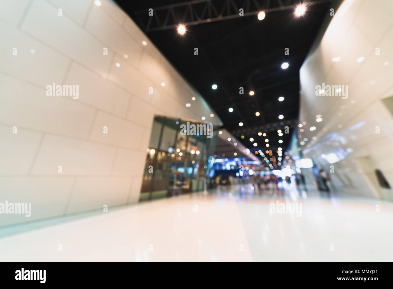 Public event exhibition hall, blurred bokeh defocused background. International business trade show, contemporary public building concept Stock Photo