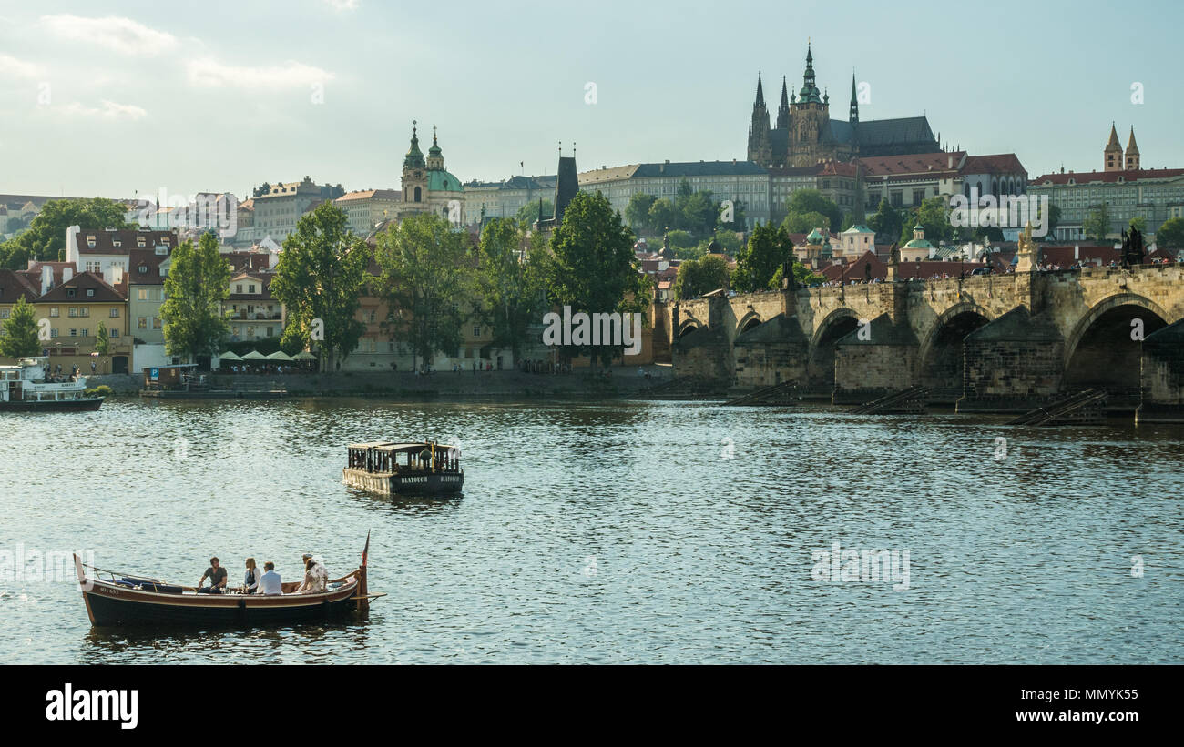 Vltava river Prague with the Castle & Charles Bridge (right) and St. Nicholas Bell Tower (left), Czech Republic Stock Photo