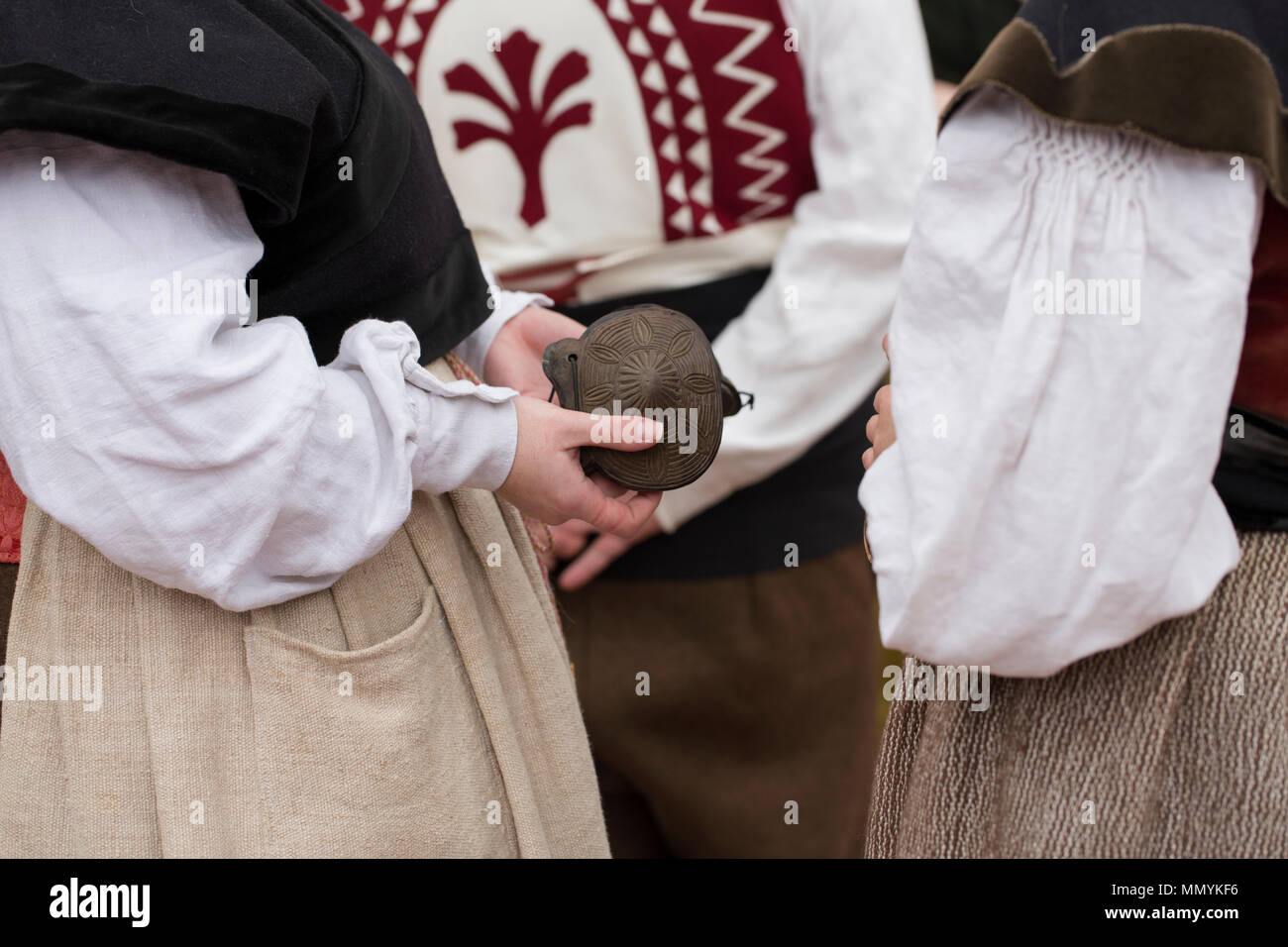 Women wearing traditional costume have got castanets in their hands Stock Photo