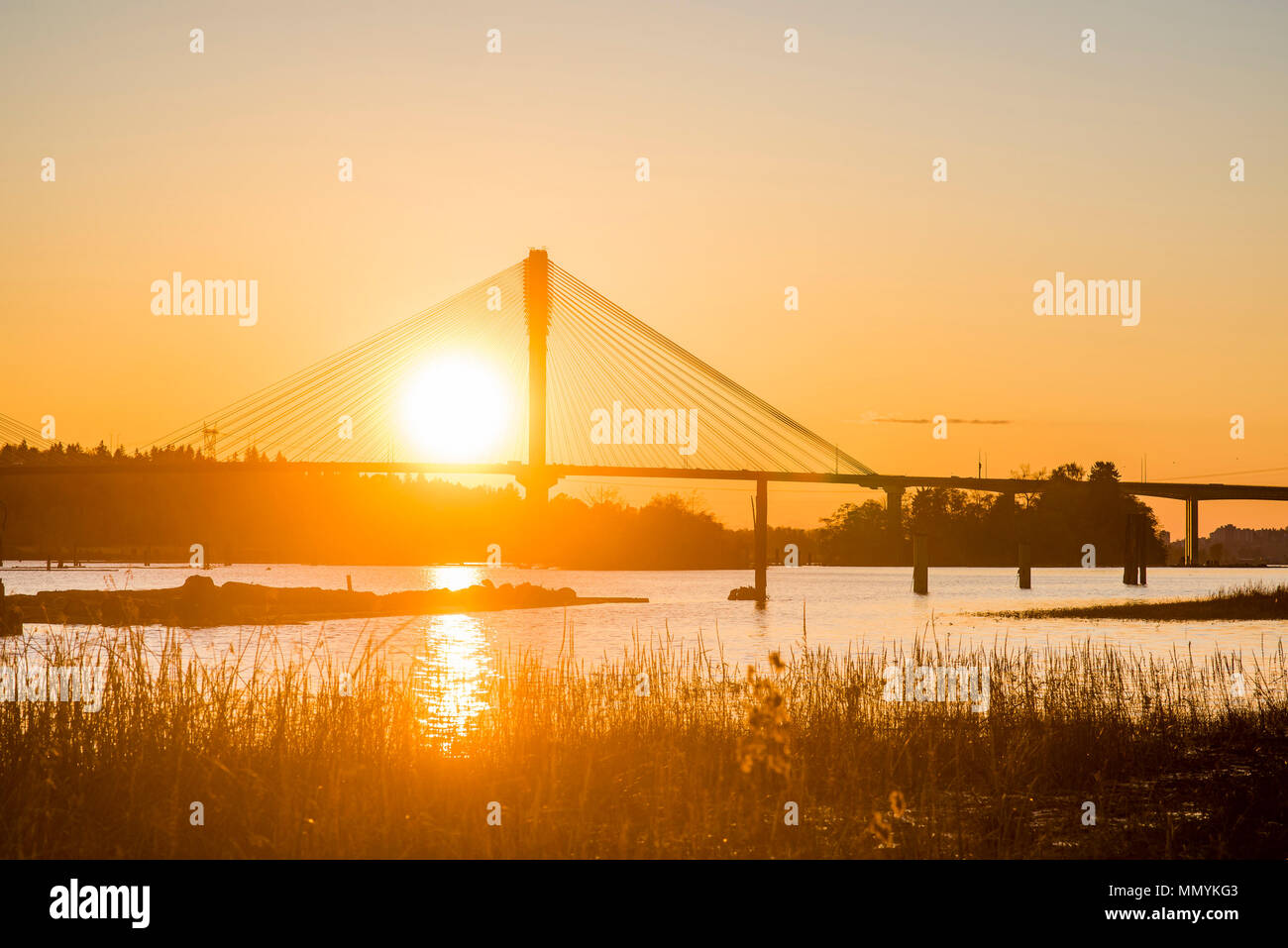 Port Mann Bridge over the Fraser River at sunset, Port Coquitlam, British Columbia, Canada Stock Photo