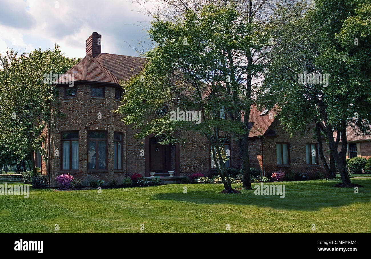 Brick home with a rounded area on the corner Stock Photo - Alamy