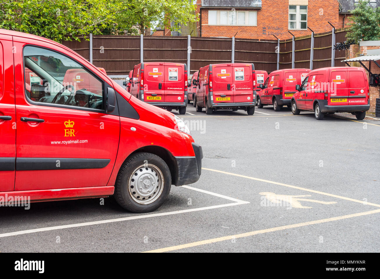 Royal Mail vans parked in the car park at The Queen Elizabeth Royal Mail Delivery Office in Windsor Stock Photo
