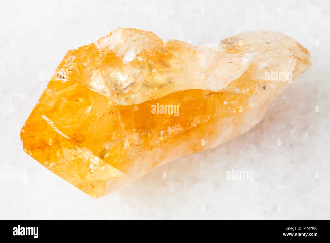 Macro Shooting Of Natural Rock Specimen Crystal Of Citrine Yellow Quartz Gemstone On White Marble Background From Brazil Stock Photo Alamy