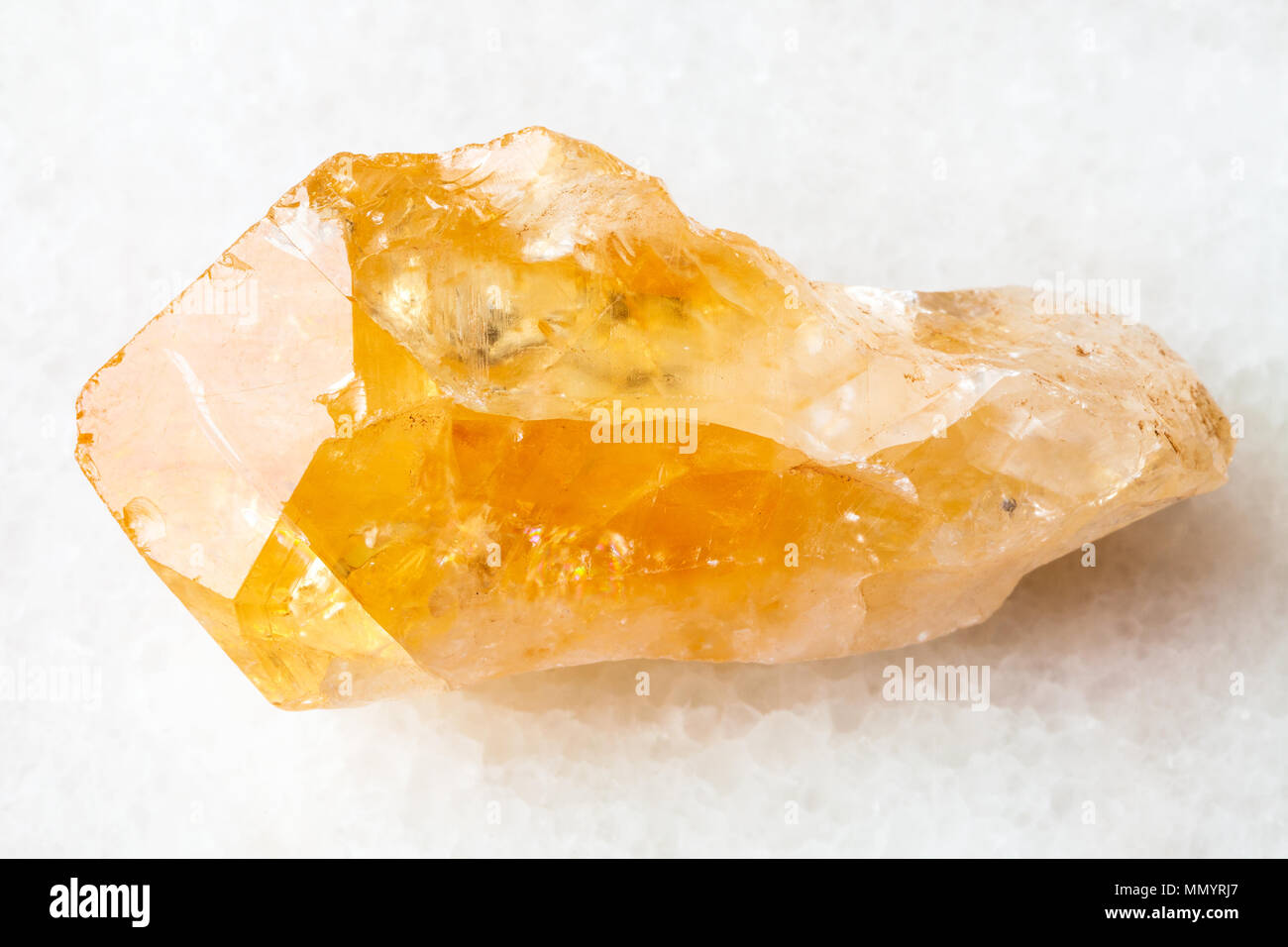 Macro Shooting Of Natural Rock Specimen Raw Crystal Of Citrine Yellow Quartz Gemstone On White Marble Background From Brazil Stock Photo Alamy