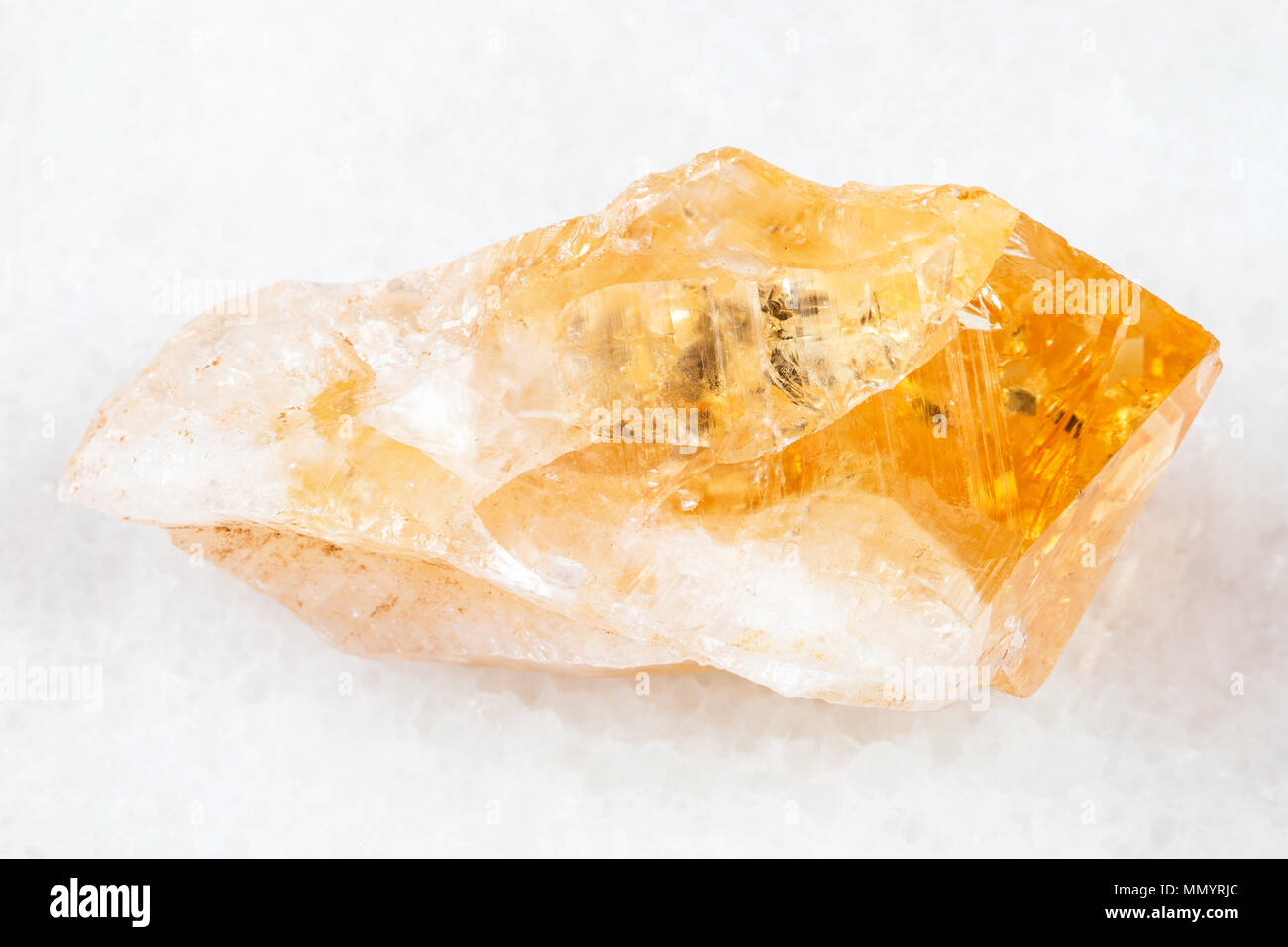 Macro Shooting Of Natural Rock Specimen Rough Crystal Of Citrine Yellow Quartz Gemstone On White Marble Background From Brazil Stock Photo Alamy