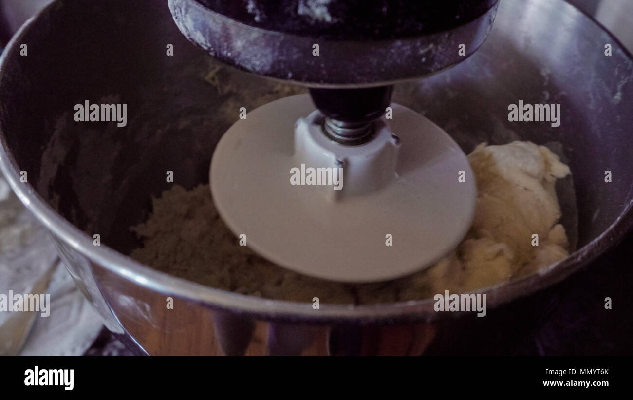Mixing dough in kitchen mixer to make Italian raviolis Stock Photo Alamy