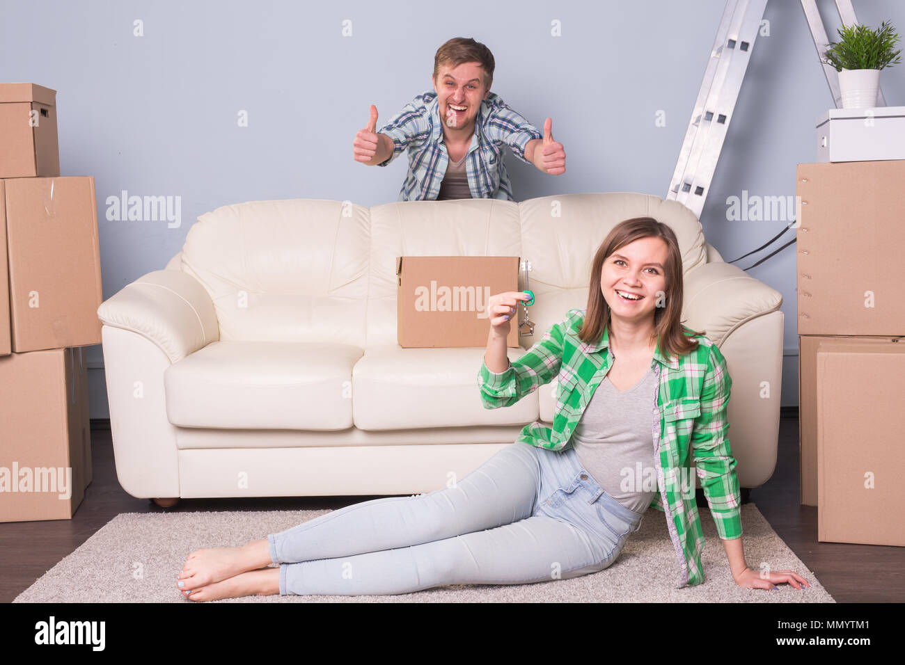 Happy love couple in her new home holding key Stock Photo - Alamy