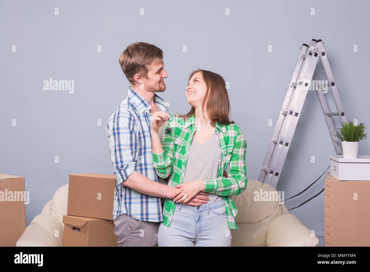 Happy love couple in her new home holding key Stock Photo - Alamy