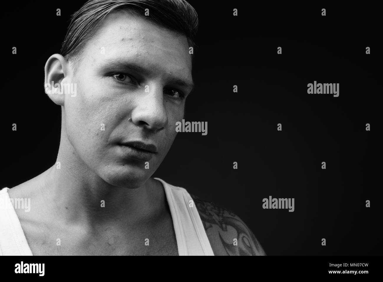 Man wearing black tank top Black and White Stock Photos & Images Alamy