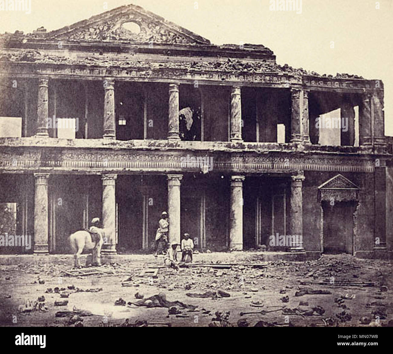 . Interior of the Secundra Bagh after the Slaughter of 2,000 Rebels by the 93rd Highlanders and 4th Punjab Regiment. First Attack of Sir Colin Campbell in November 1857, Lucknow. Albumen silver print, by Felice Beato, 1858. Located on the outskirts of Lucknow, it was the scene of intense fighting in November, 1857. Following the action, the British dead were buried in a deep trench but the Indian corpses were left to rot. Later, the city had to be evacuated and was not recaptured until March 1858 and it was shortly afterwards that Beato probably took this photograph. As one contemporary commen Stock Photo