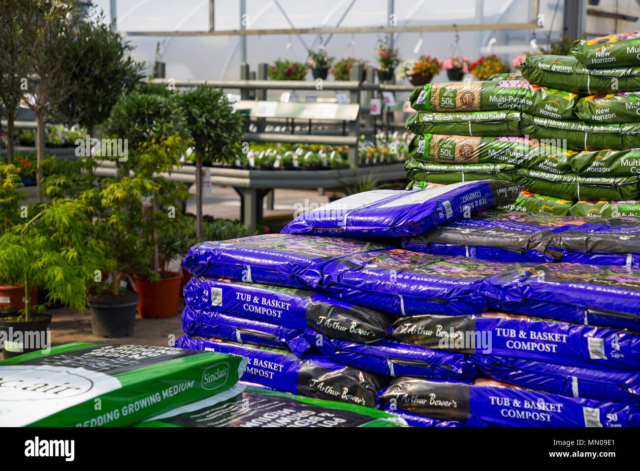 Stacks of compost bags for sale at a Garden Nursery Stock Photo Alamy