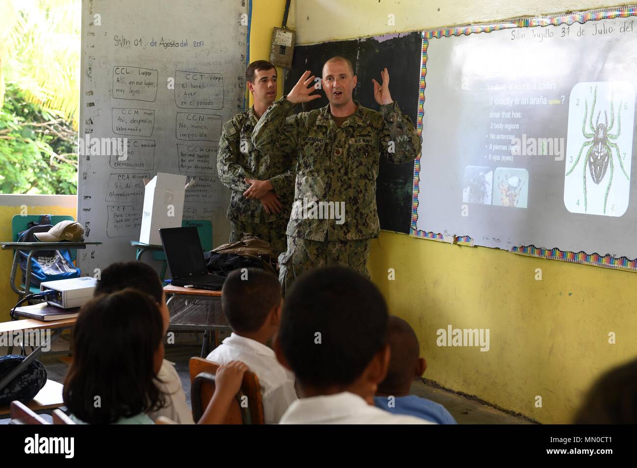 170801-N-BK435-0101 SILIN, Honduras (Aug. 1, 2017) Lt. Cmdr. Ian Sutherland, technical director for the Navy Entomology Center of Excellence, teaches an entomology class for 78 children at República de Colombia Elementary School during a Southern Partnership Station 17 community relations project (COMREL). SPS-EPF 17 is a U.S. Navy deployment, executed by U.S. Naval Forces Southern Command/U.S. 4th Fleet, focused on subject matter expert exchanges with partner nation militaries and security forces in Central and South America. (U.S. Navy photo by Mass Communication Specialist 1st Class Jeremy  Stock Photo