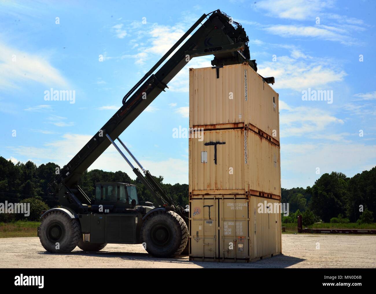 170802 N At856 036 Williamsburg Va August 2 2017 A Reserve Component Sailor Assigned To Navy Cargo Handling Batallion Thirteen Operates A Rough Terrain 240 Kalmar Container Handler And Completes A Hatchbox Triple Stack