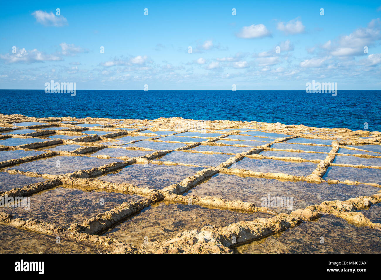 Salt evaporation ponds on Gozo island, Malta Stock Photo