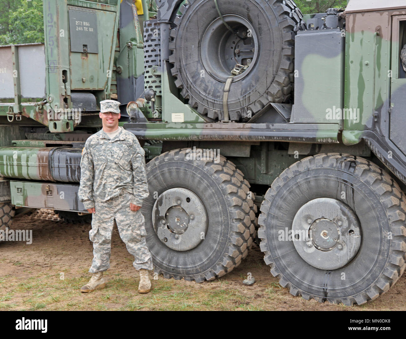 Sgt. Joshua Juarez, a motor transport operator with the 1460th Transportation Company, 246th Battalion, stands next to his Palletized Load System (PLS) during Northern Strike 17 at Camp Grayling Joint Maneuver Training Center August 2, 2017. (Michigan Army National Guard photo by Sgt. Seth LaCount) Stock Photo