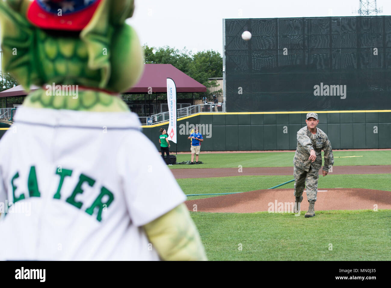 Col. Adam Willis, 445th Airlift Wing commander, throws out the ceremonial first pitch during the Dayton Dragons salute to hometown heroes event at Fifth Third Field in Downtown Dayton, Aug. 5, 2017. The Dayton Dragons took on the Lansing Lugnuts losing the game with a score of 4-1.  (U.S. Air Force photo/ Wesley Farnsworth) Stock Photo