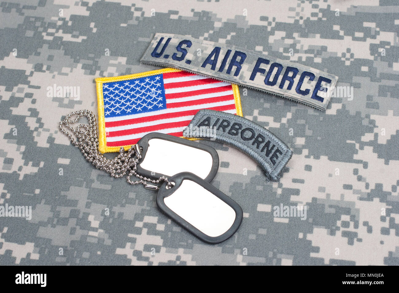 US ARMY airborne tab with blank dog tags on camouflage uniform Stock ...