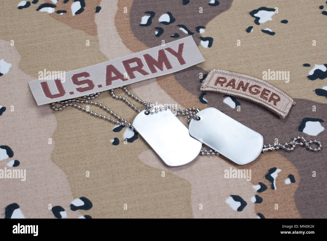US ARMY ranger tab with blank dog tags on camouflage uniform Stock ...