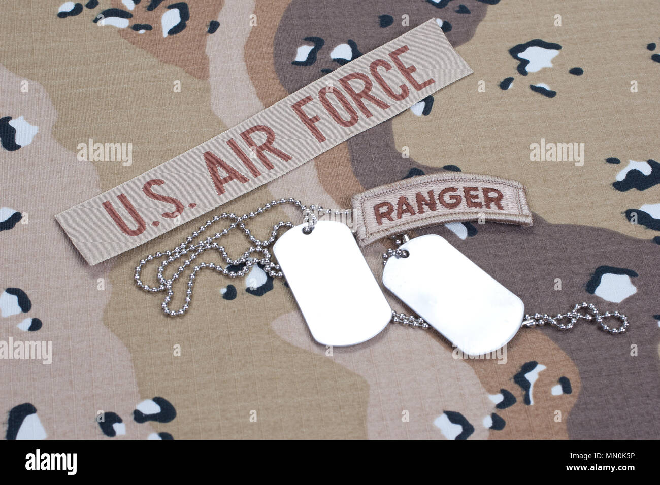 Field Ranger Tag US ARMY ranger tab with blank dog tags on camouflage uniform Stock ...