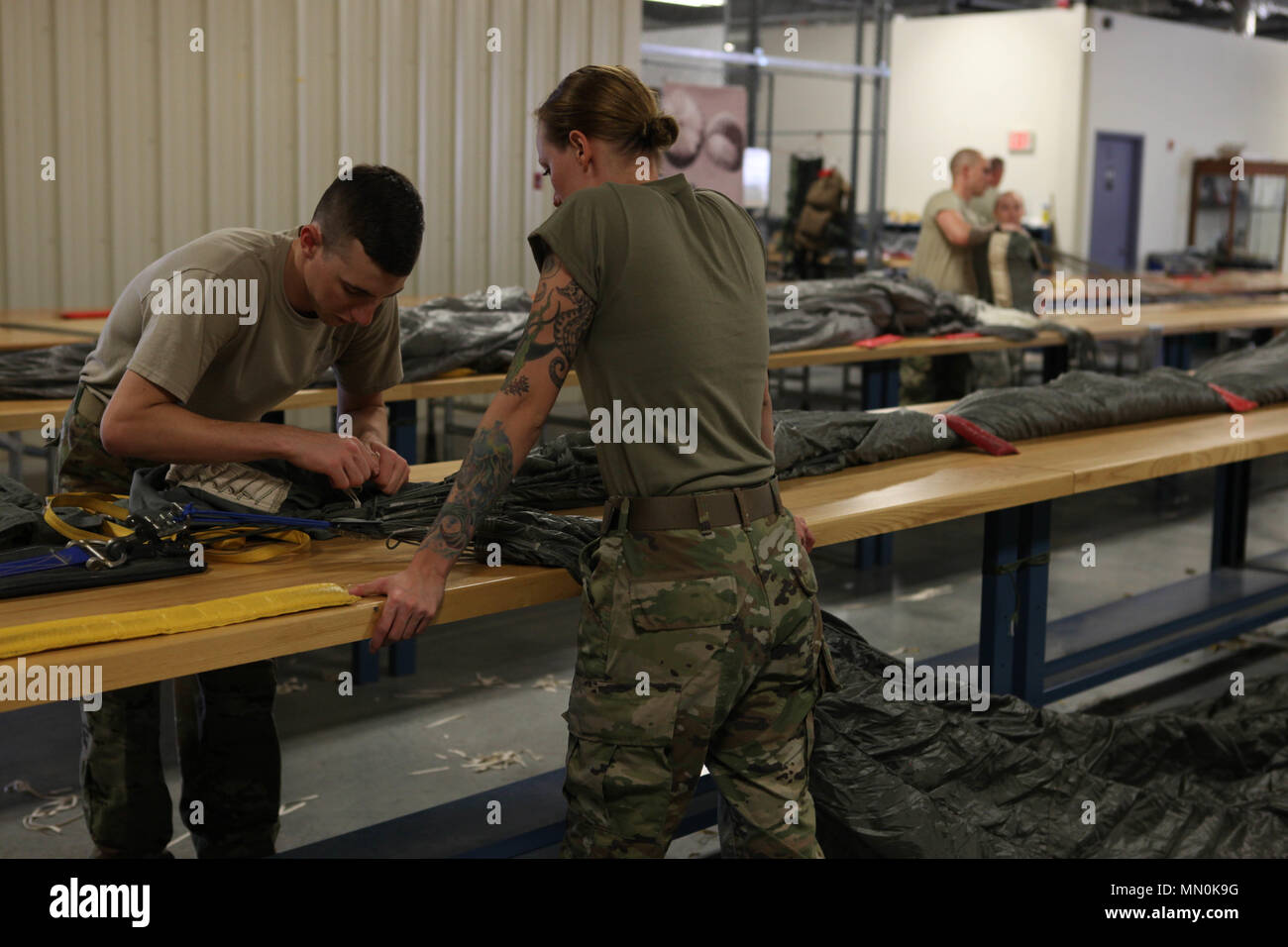 U.S. Army parachute riggers, from the 165th Quartermaster Company ...