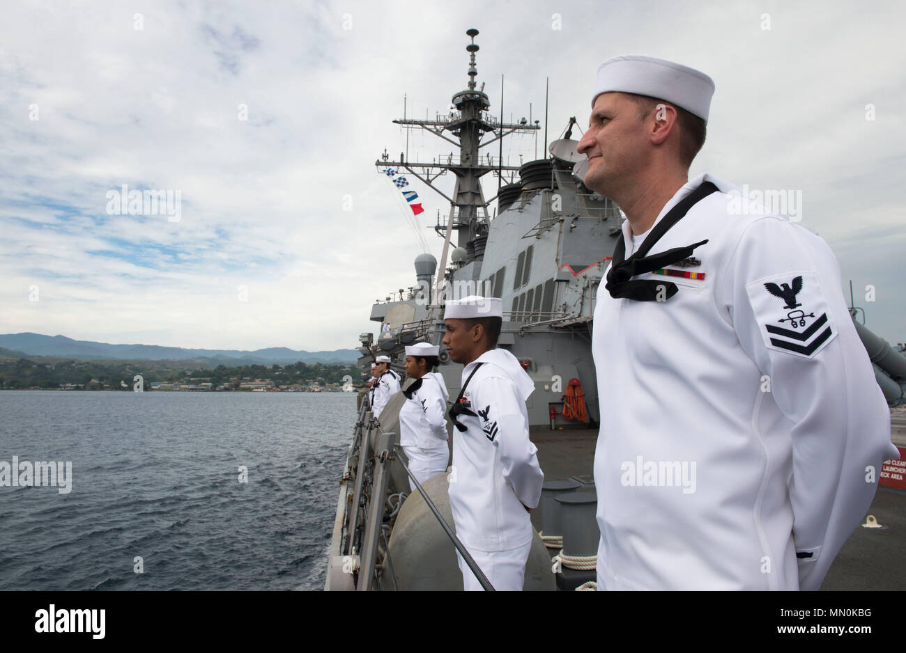 HONIARA, Guadalcanal (Aug. 4, 2017) Sonar Technician (Surface) 2nd Class Matthew Fryer, assigned to the Arleigh Burke-class guided-missile destroyer USS Barry (DDG 52), stands at parade rest while pulling into Guadalcanal for a port visit to commemorate the 75th anniversary of the Guadalcanal Campaign. The 75th commemoration is a tribute to courage, service, and sacrifice of those who fought in the Guadalacanal Campaign of World War II. (U.S. Navy photo by Mass Communication Specialist 2nd Class William Collins III/Released) Stock Photo
