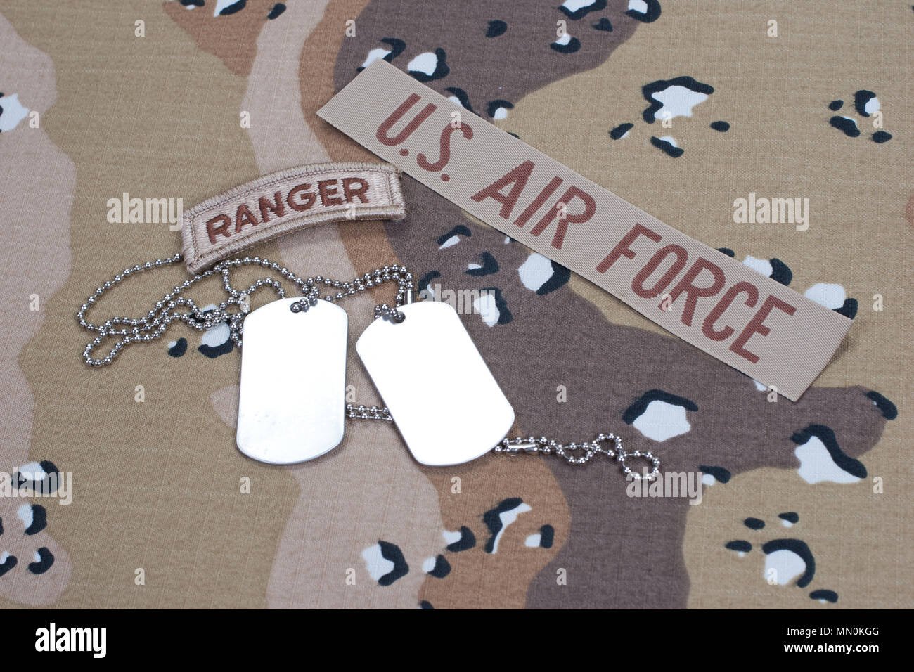 US ARMY ranger tab with blank dog tags on camouflage uniformUS ARMY ...
