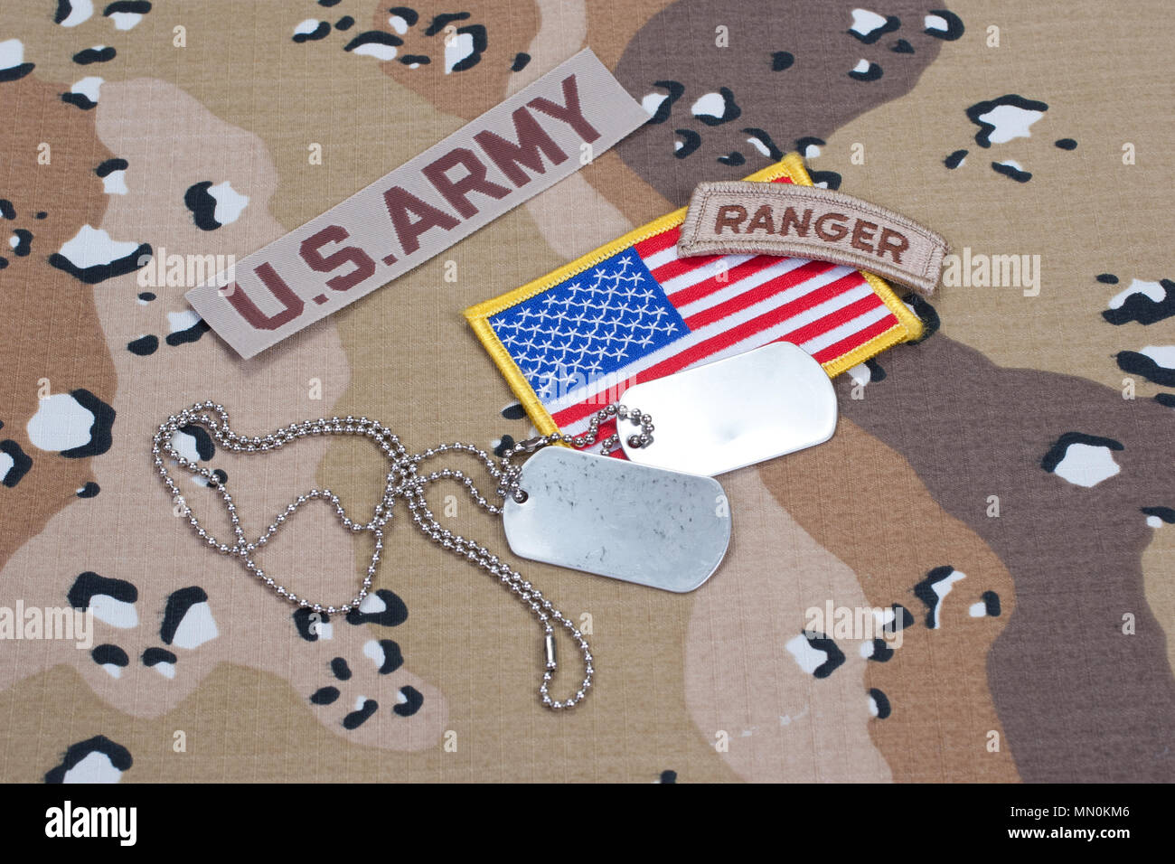 US ARMY ranger tab with blank dog tags on camouflage uniform Stock ...