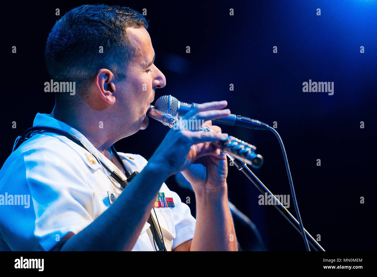 TOMBALL, Texas (Aug. 7, 2017) Musician 1st Class Manuel Pelayo De Gongora performs with the U.S. Navy Band Cruisers popular music group at the Lone Star College Performing Arts Center in Tomball, Texas. The U.S. Navy Band performed in four states during its 14-city national tour, connecting the Navy to communities that don't see Sailors at work on a regular basis. (U.S. Navy photo by Chief Musician Adam Grimm/Released) Stock Photo