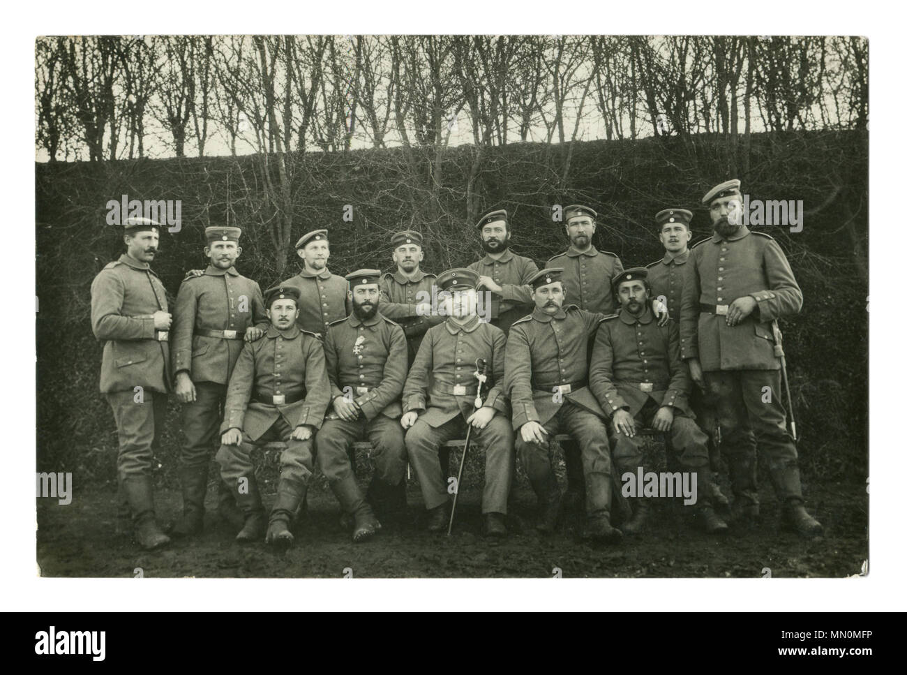 Old German photo of 1914: group portrait of a military unit, the soldiers and the officer with a saber. The Bavarian Military Merit Order. world war I Stock Photo