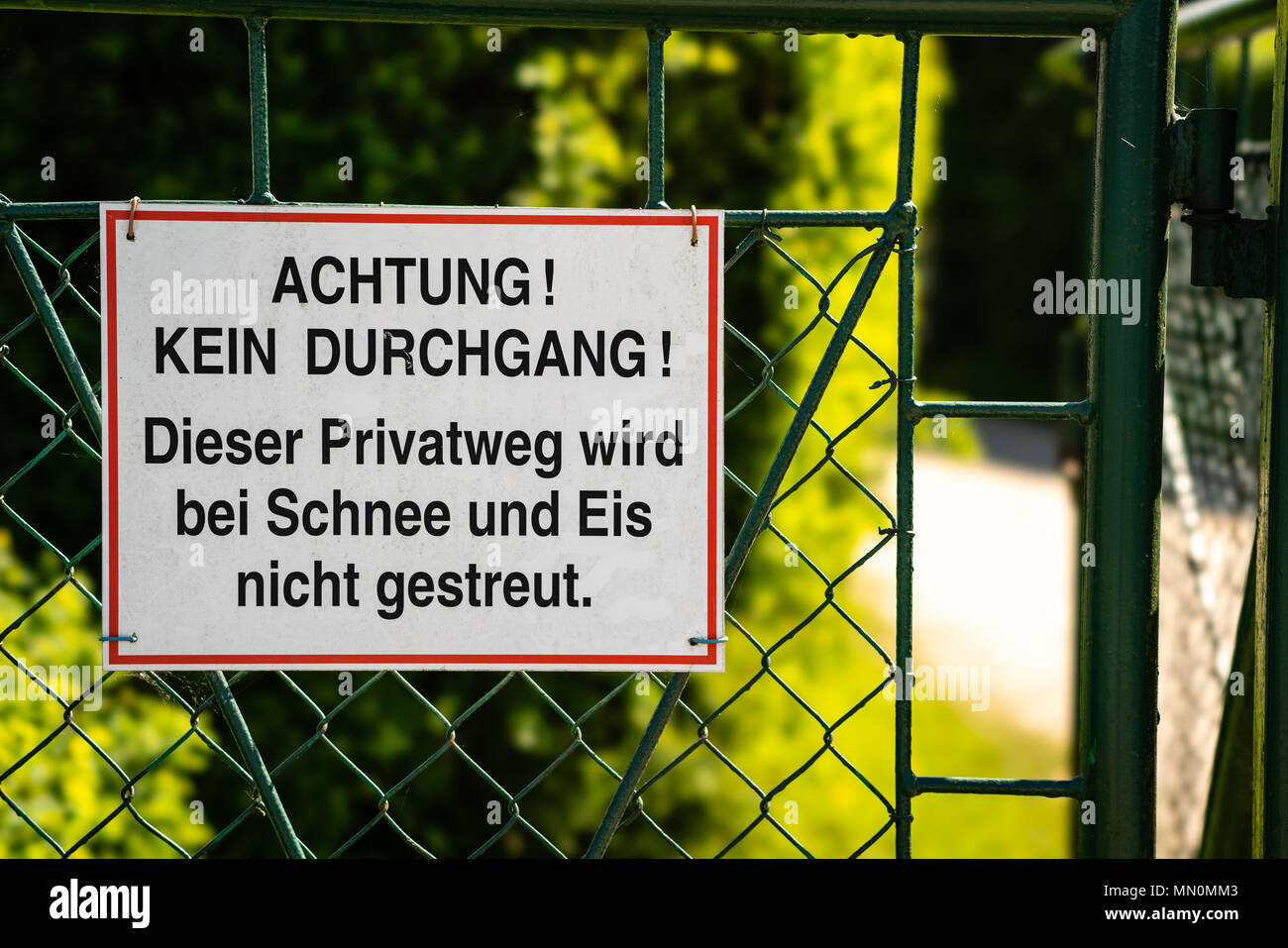 Attention - no entry allowed - no winter services - Achtung - kein Durchgang - Eis und Schnee Stock Photo