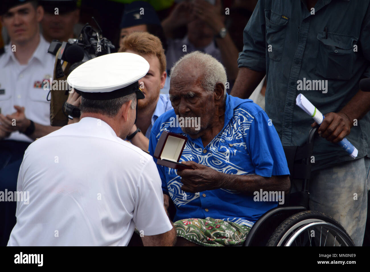 Commodore Stephen Woodall, Royal Australian Navy, presents the