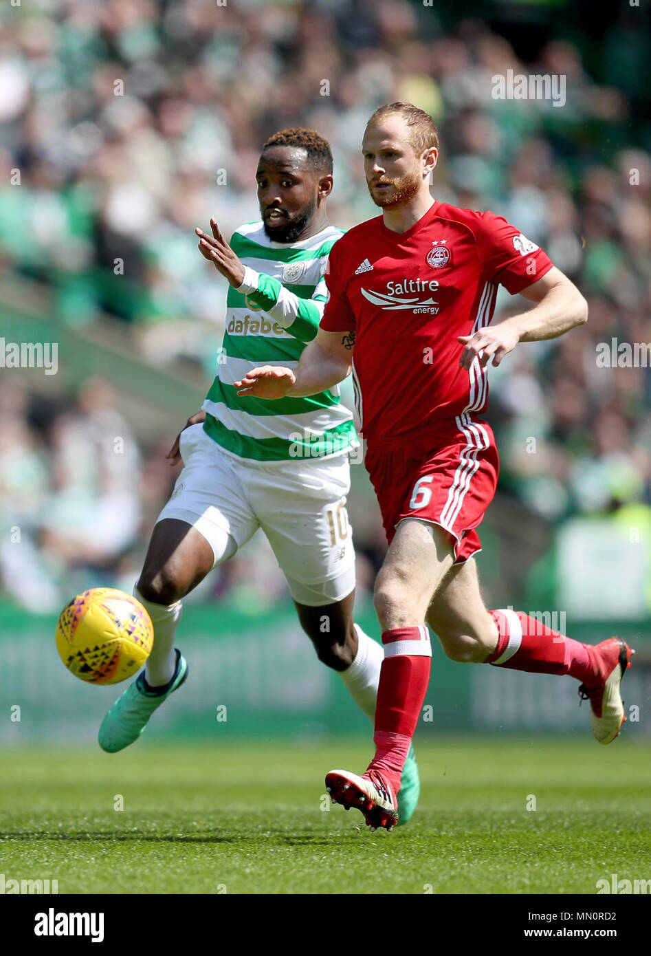 Celtic's Moussa Dembele and Aberdeen's Mark Reynolds battle for the ball during the Ladbrokes Scottish Premiership match at Celtic Park, Glasgow. Stock Photo