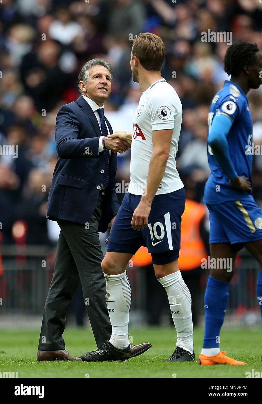 Tottenham Hotspur's Harry Kane shakes hands with Leicester City manager Claude Puel at full time during the Premier League match at Wembley Stadium, London. Stock Photo