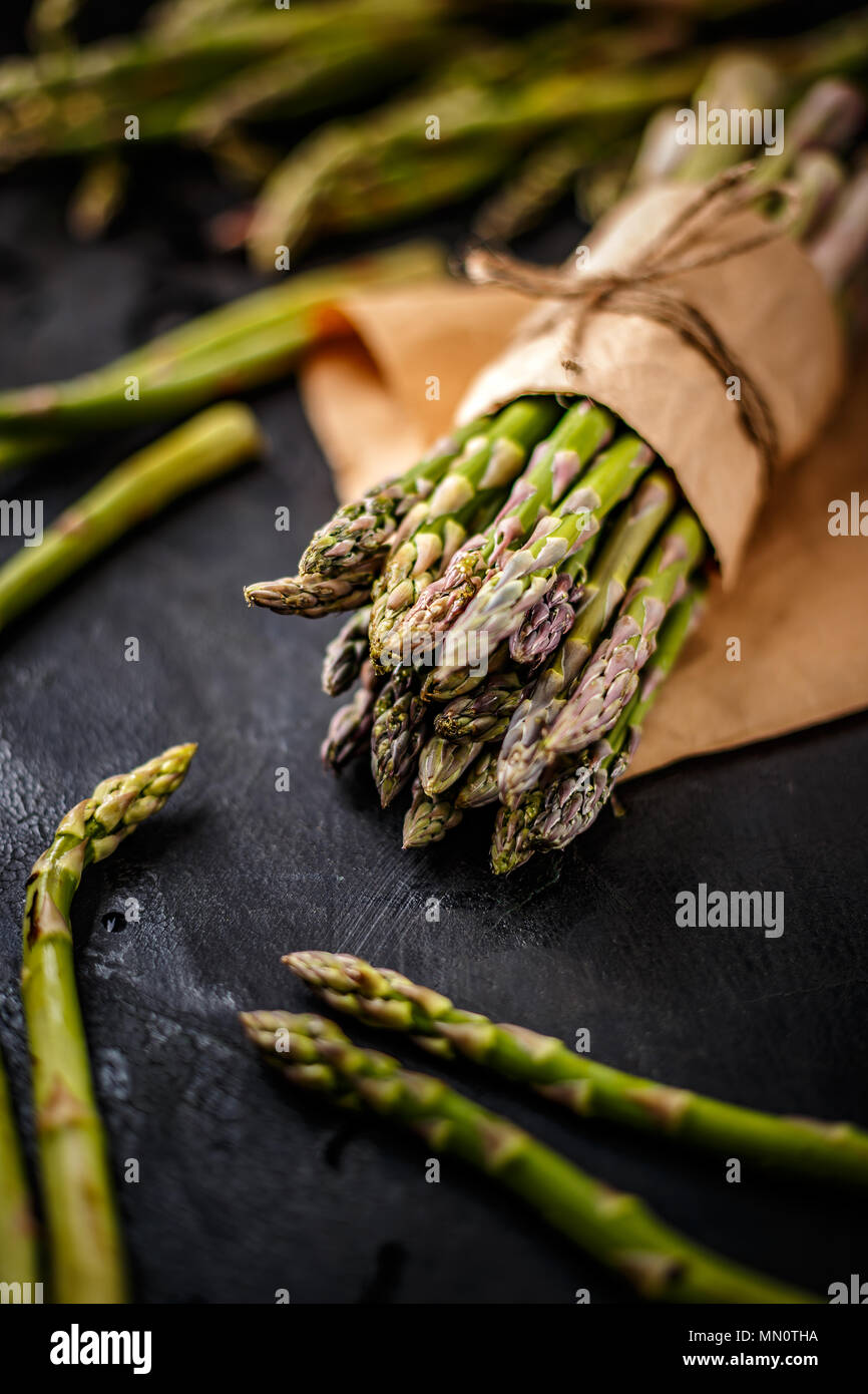 Healthy food concept. Fresh green asparagus on a black background Stock Photo